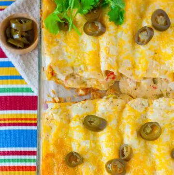 Creamy White Sauce and Crab Enchiladas in a baking dish
