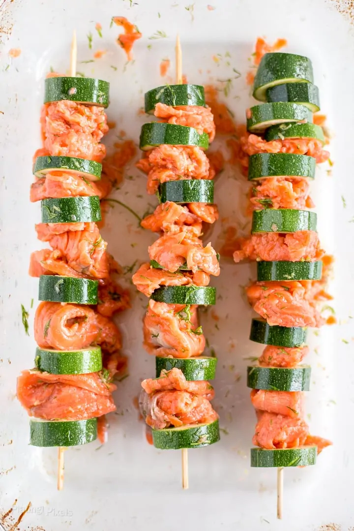 Three marinated Salmon Kabobs ready to grill