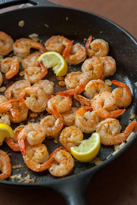 Process shot of shrimp cooking in a pan