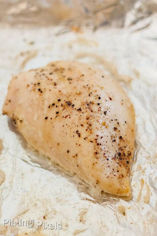 Moist baked chicken breast on over foil on a baking sheet