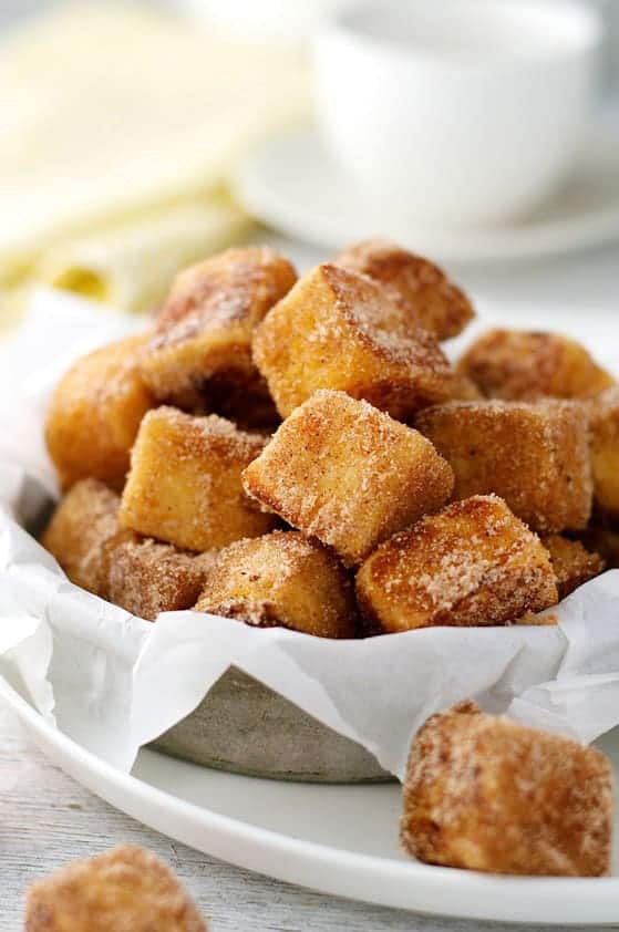 Pile of Cinnamon French Toast Bites in a metal bowl