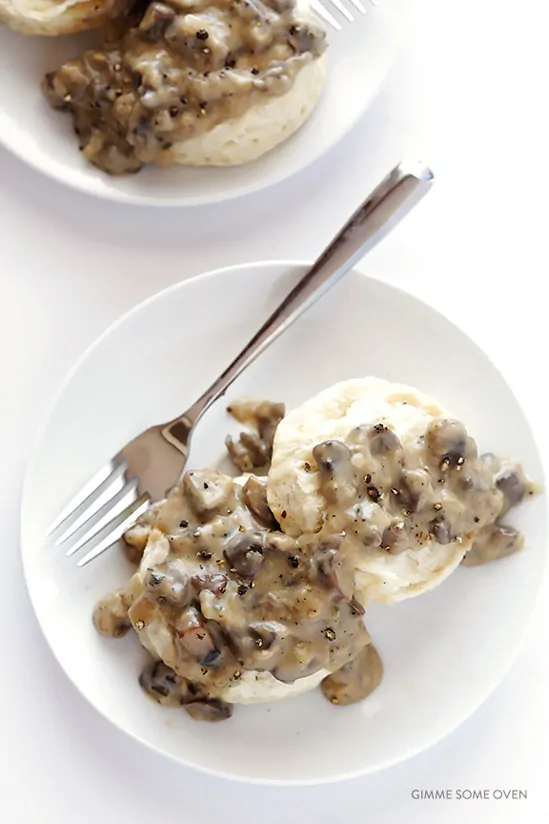 Overhead shot of vegan biscuits and gravy on a white plate