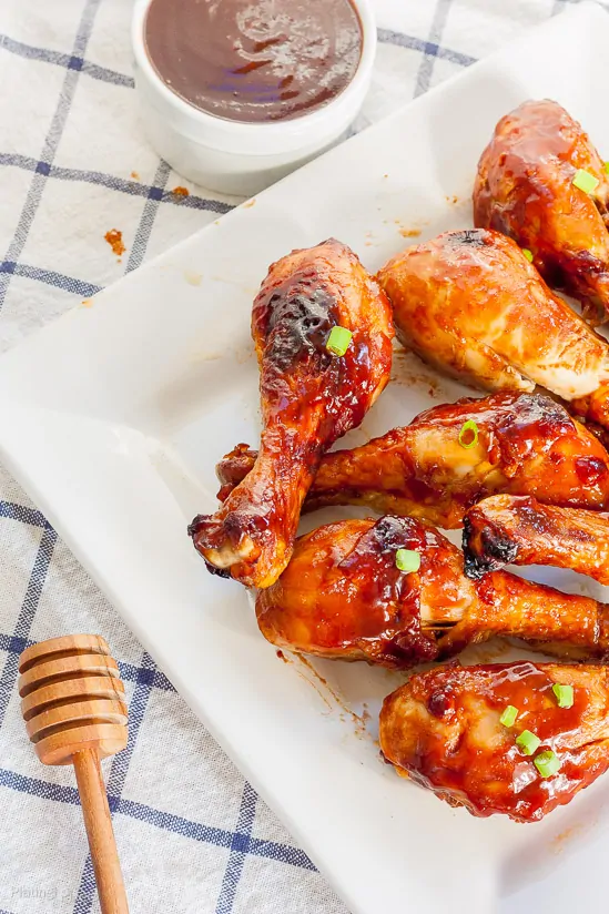 Easy Honey BBQ Oven Baked Chicken Drumsticks on a plate 