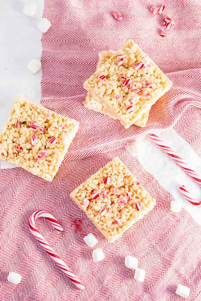An overhead shot of Brown Butter Peppermint Rice Krispie Treats on a white and red surface