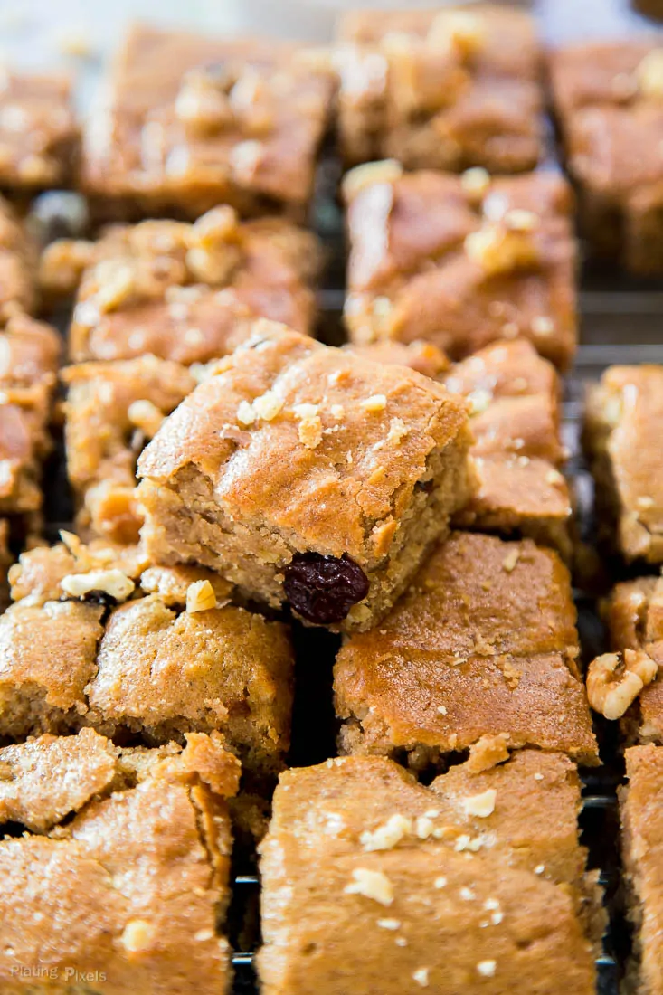 A close up of Cranberry Maple Blondies cut into squares