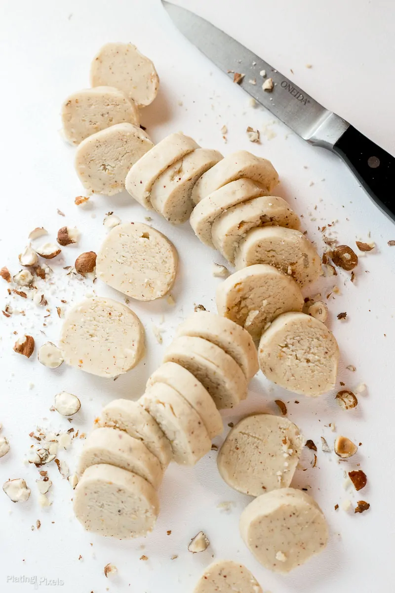 Cutting chilled shortbread cookie dough into slices with a knife
