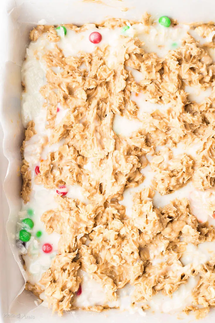 A close up of Chewy Coconut Chocolate Oatmeal Bars in a baking pan