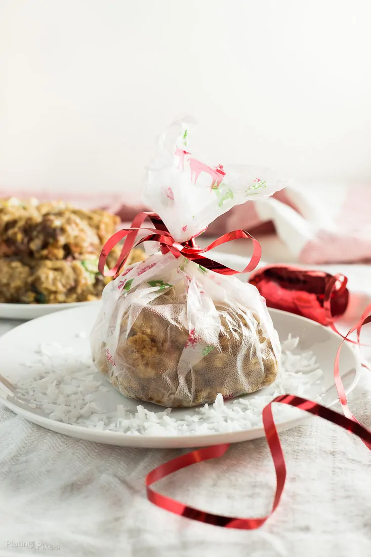 Chewy Coconut Chocolate Oatmeal Bars in a gift bag tied with a red ribbon