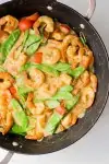 One Pot Coconut Curry Shrimp cooking in stir-fry pan