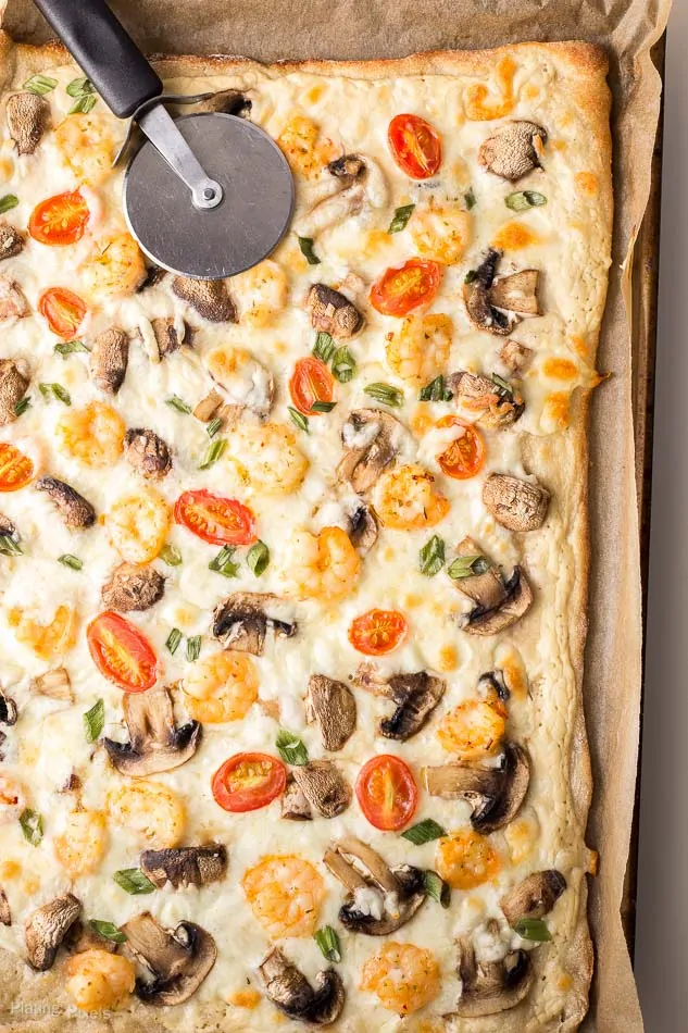 Shrimp Scampi Flatbread Pizza on a baking sheet