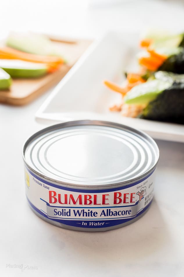 A tin of Bumble Beee white albacore tuna sitting on a white table