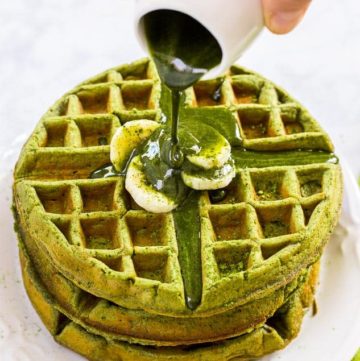 Matcha Green Tea Waffle on a white plate with matcha syrup
