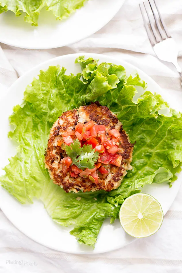 An overhead shot of tuna cakes on romaine lettuce wraps