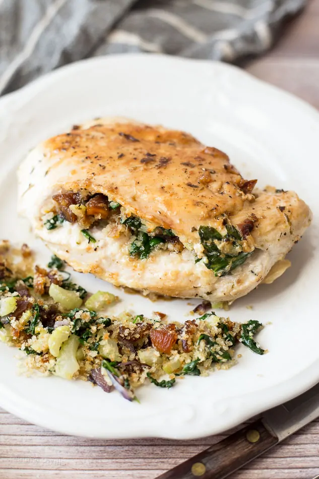 Apricot and Spinach Stuffed Chicken Breasts on a white plate