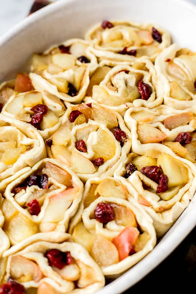 Rolled Apple Pie Puff Pastry slices in a casserole dish to be baked