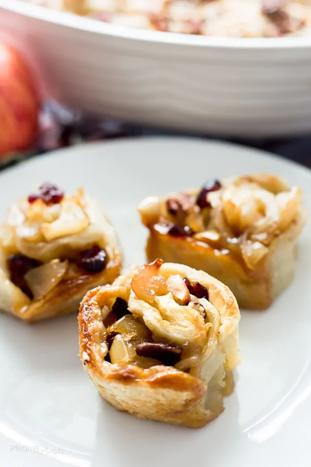 Three Apple Pie Puff Pastry Rolls on a plate
