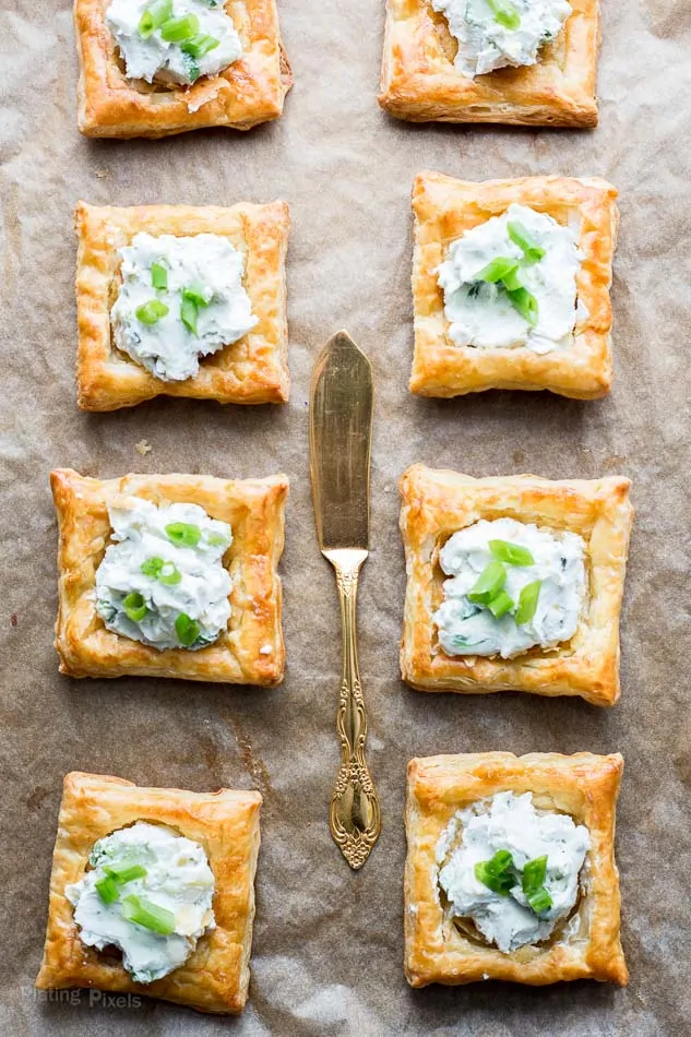 An overhead shot of Blue Cheese Puff Pastry Squares on a baking shot