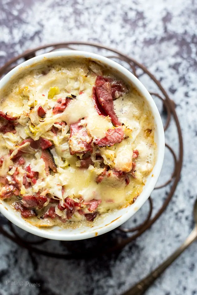 A close up of a Hot Reuben Cheese Dip in a white bowl