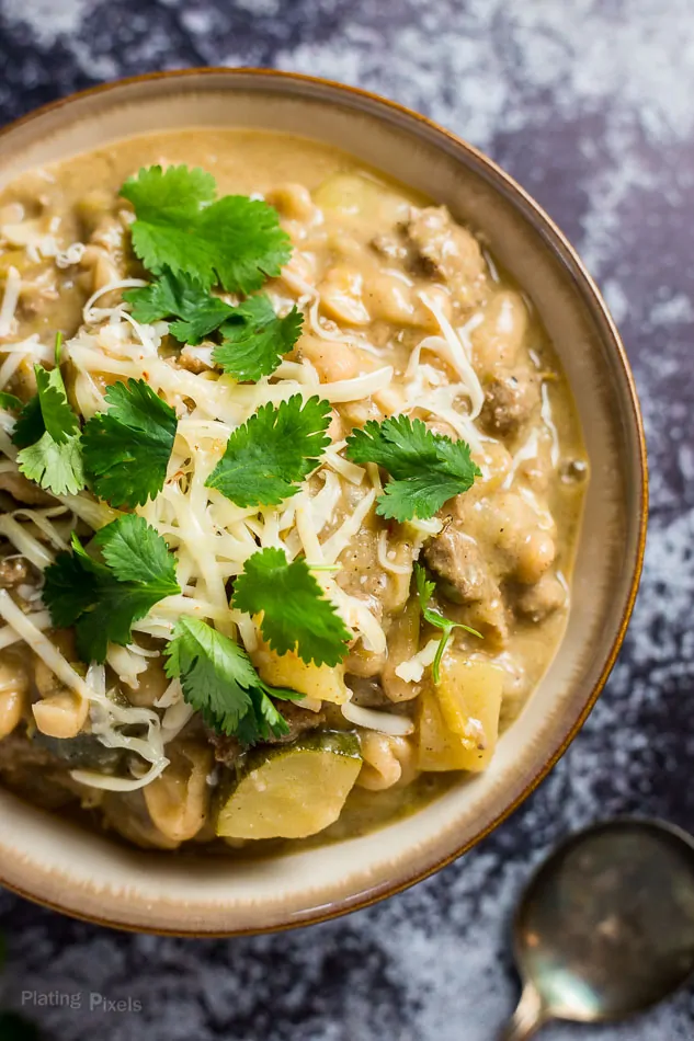 A close up of a bowl of Healthy White Bean Turkey Chili garnished with cilantro