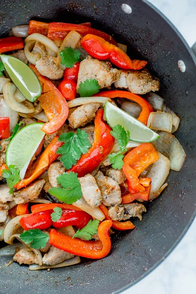 Pork Fajita and veggies cooking in a pan