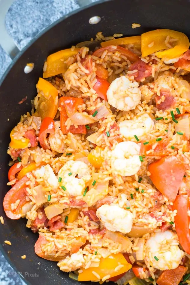 Process shot of Shrimp Paella cooking in a pot