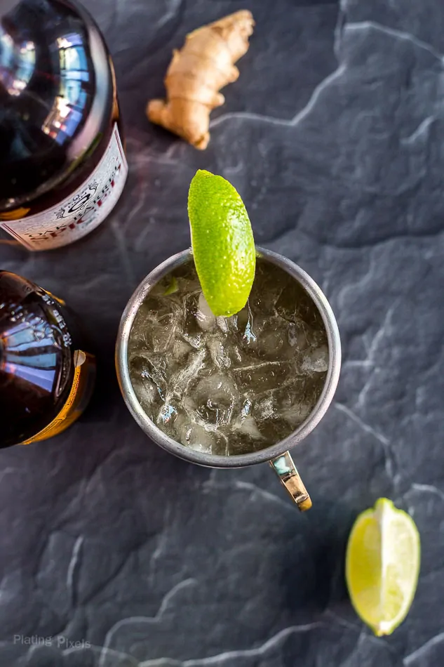 Overhead shot of Caribbean Mule in a copper mug garnished with lime wedge (Moscow Mule with rum)