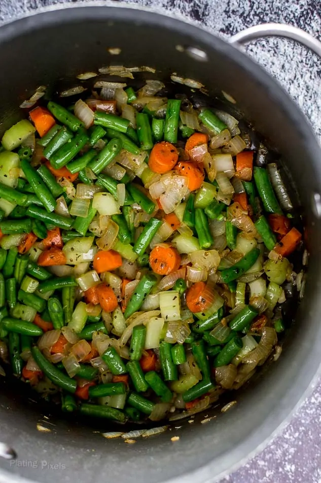 Chopped vegetables in a large pot for making chicken minestrone soup