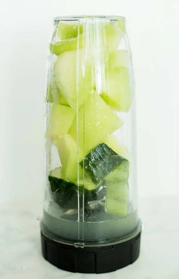 Blending Cucumber Melon Cocktail Slushie in a blender