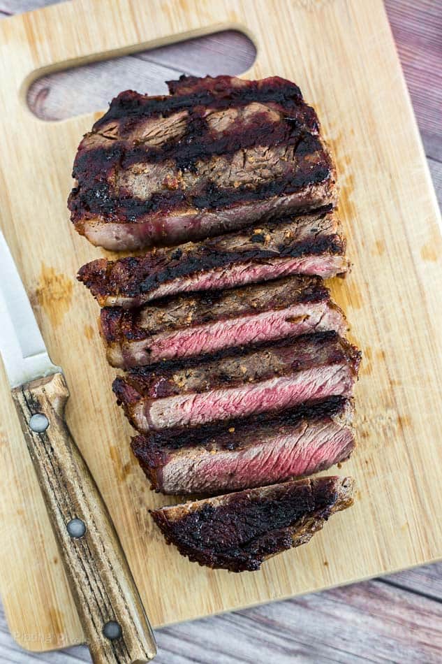 Grilled Ribeye Steak slices on a cutting board