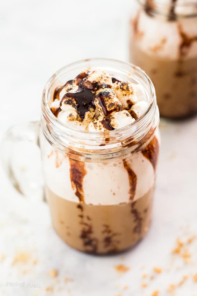 Close up of Homemade S'mores Frappe in a glass topped with toasted marshmallows