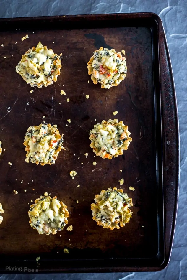 Mini Parmesan Spinach Phyllo Cup Appetizers on a baking tray