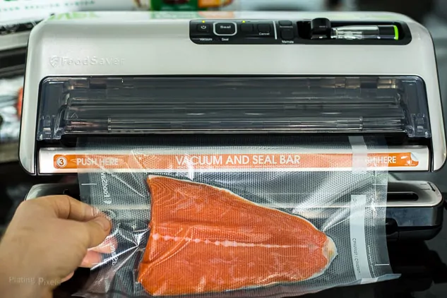 Sealing salmon filet in a vacuum food sealer