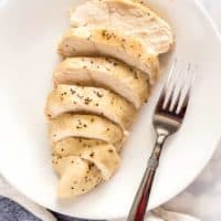 Sliced baked chicken breast on a plate