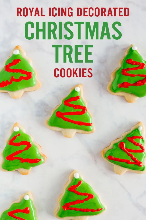 Decorated Christmas Tree Cookies with Royal Icing on a white background with text image for Pinterest