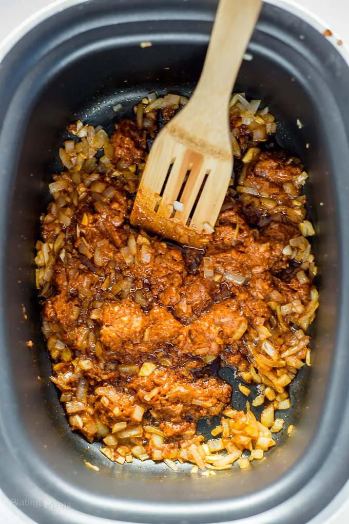 Cooking chorizo and onions on stove