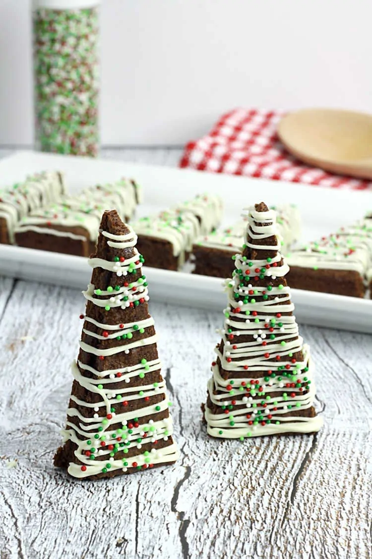 Two Chocolate Brownie Trees with Mint White Chocolate Drizzle on a wooden table