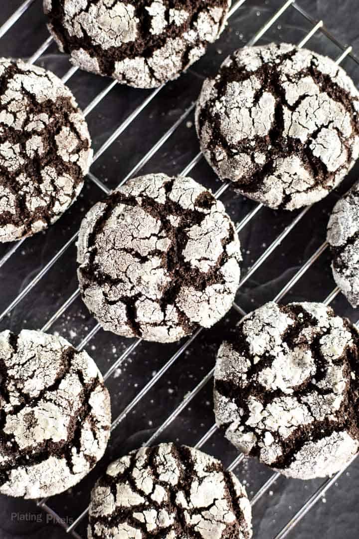 Baked Chocolate Crackle Cookie Sandwiches cooling on a wire rack