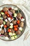 Overhead shot of plate of Greek Baked Meatballs and veggies