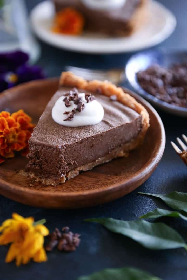 Closeup of Avocado Chocolate Silk Pie on a brown plate - Roundup of Romantic Chocolate Desserts for Valentine's Day