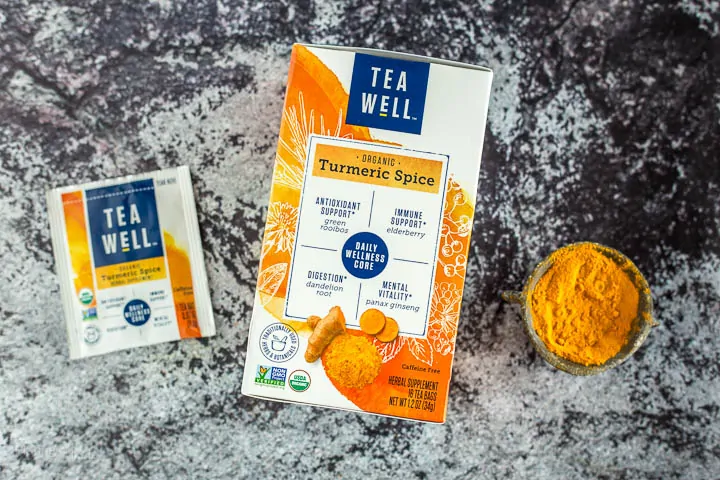 TeaWell™ Organic Turmeric Spice package next to turmeric powder
