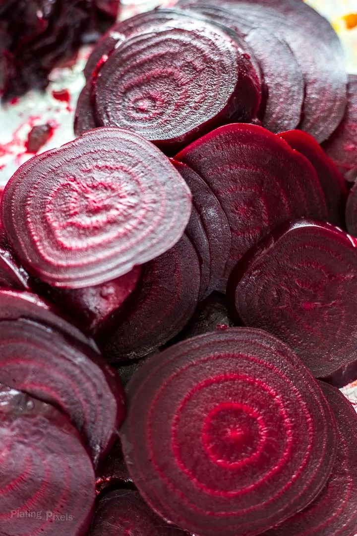 Pile of peeled roast beet slices for Refrigerator Pickled Beets