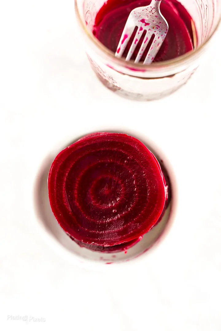 Overhead shot of a Refrigerator Pickled Beet slice in a serving dish