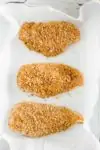 Three Baked Breaded Chicken Breast in a bakind dish