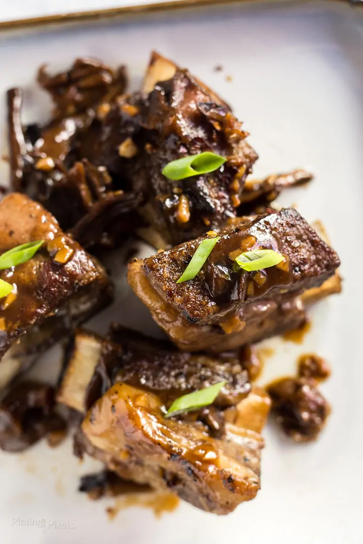 Close-up of Slow Cooker Short Ribs with Korean Sauce on a plate 