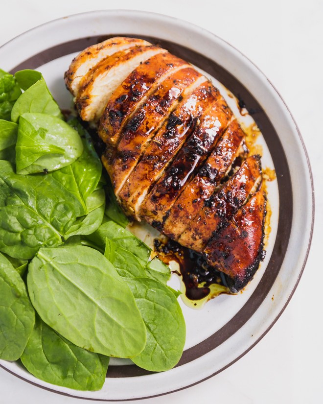 Baked Balsamic Chicken Breast sliced on a plate