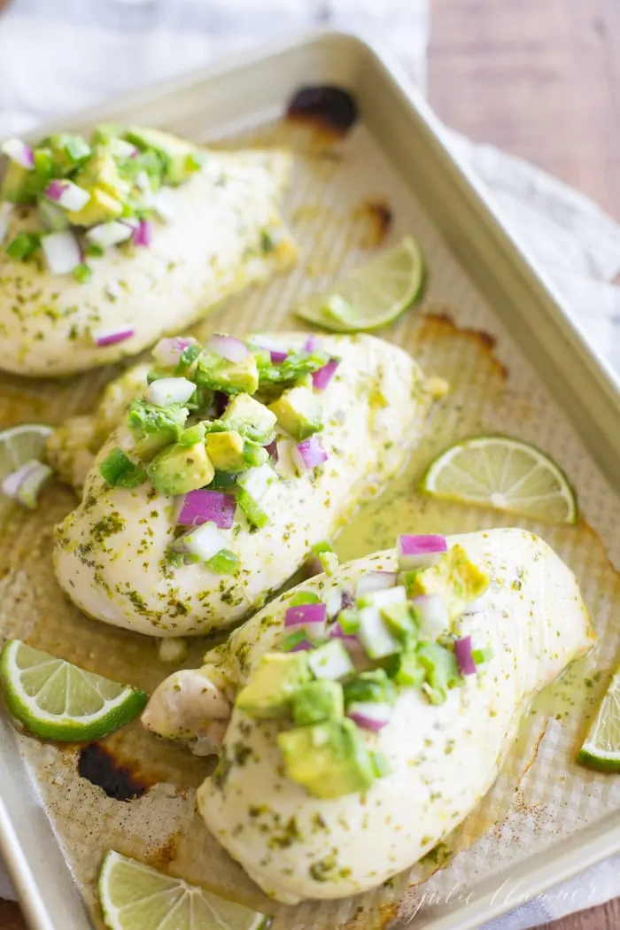 Three Cilantro Lime Chickens on a baking sheet