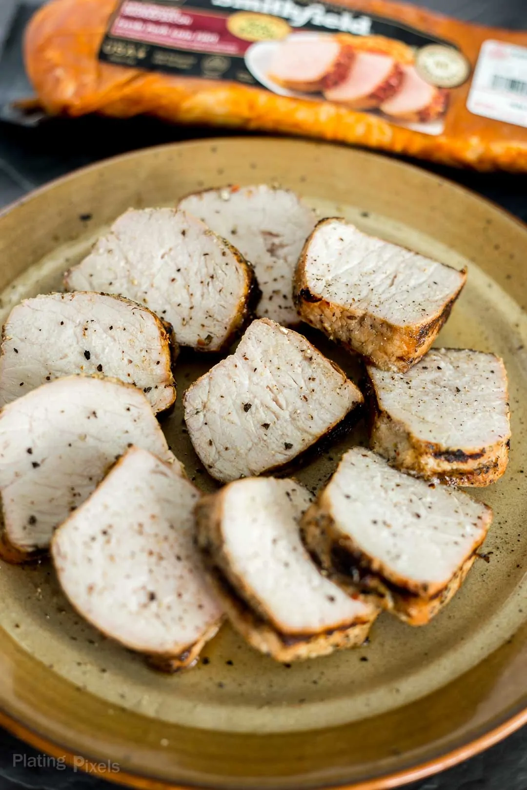 Slices of grilled pork tenderloin on a plate