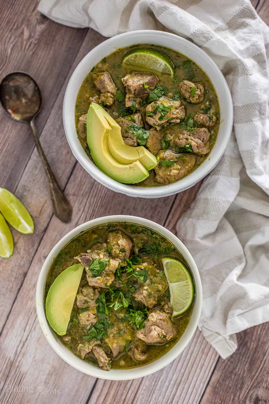 Overhead shot of two bowls of Pork Chile Verde