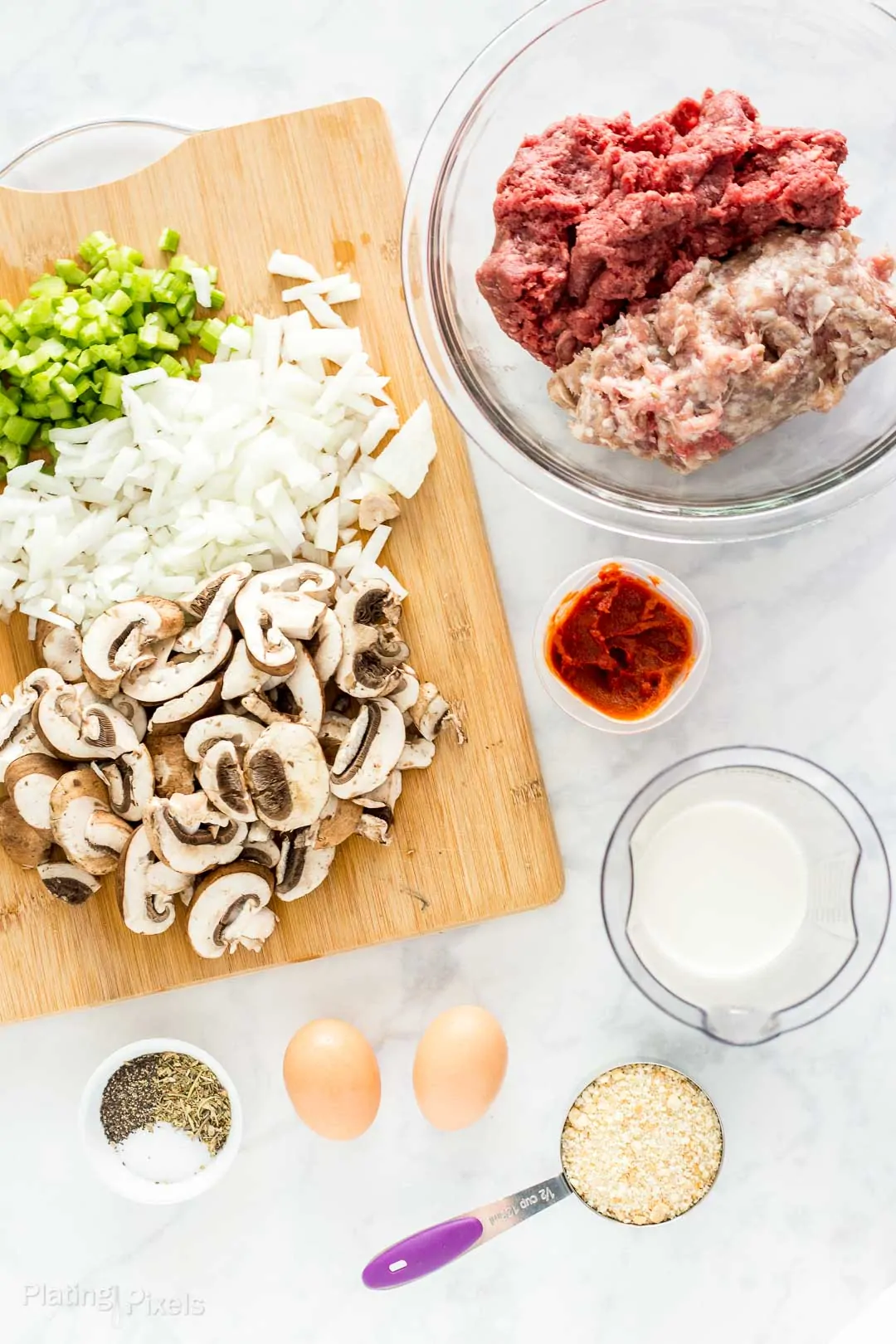 Prepared ingredients laid out to make mushroom meatloaf mixture