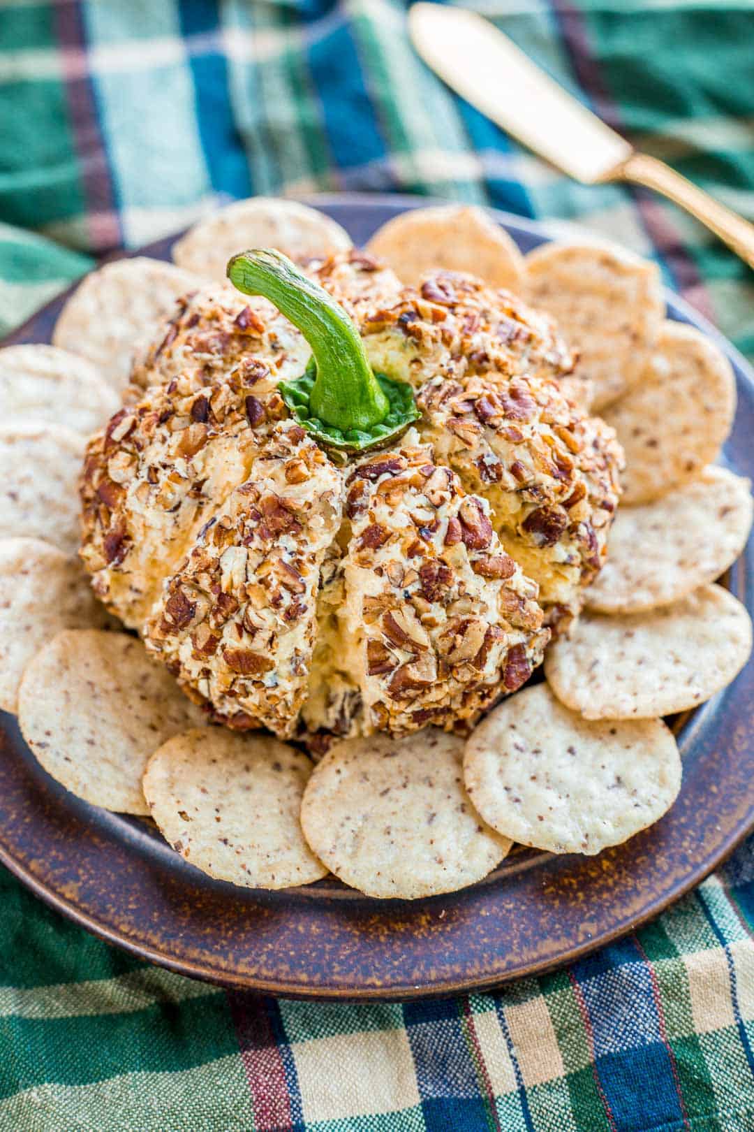 Close up of a Pumpkin Cheese Ball paired with crackers